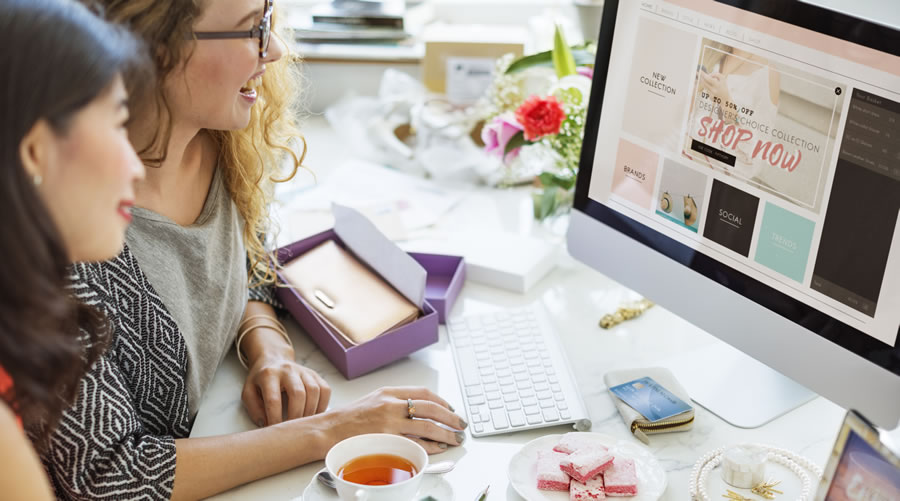 women working at computer online store